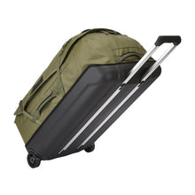Load image into Gallery viewer, Angled back panel vie of the olivine green duffle bag tilted. The back panel is made of black poly-carbonate to protect your contents.