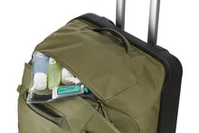 Load image into Gallery viewer, Angled top panel view showing a bag of toiletries peeking from the zipper-closing pocket.