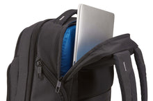 Load image into Gallery viewer, Close up to the top, showing a laptop being tucked into the back panel's compartment.