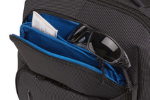 Load image into Gallery viewer, Close up to the front panel's pocket with a ticket and a pair of sunglasses tucked in the compartment.