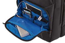 Load image into Gallery viewer, Close up to the bottom front pocket, unzipped. The compartments are filled with a phone, notebook, a leather card case, pens, and a battery bank.