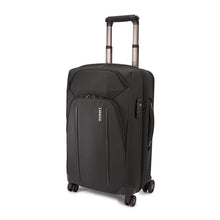 Load image into Gallery viewer, Angled front panel view of the black suitcase wit the telescopic handle partly extended.