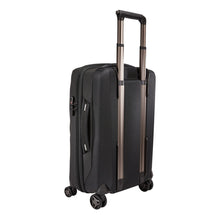 Load image into Gallery viewer, Angled back panel view of the black suitcase with the telescopic handle partly extended.