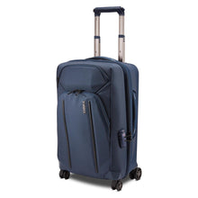 Load image into Gallery viewer, Angled front panel view of the blue suitcase with the telescopic handle partly extended.