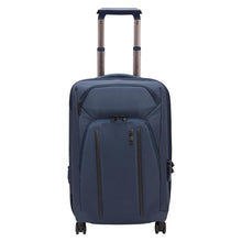 Load image into Gallery viewer, Front panel view of the blue suitcase with the telescopic handle extended.