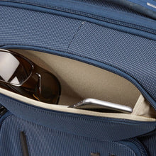 Load image into Gallery viewer, Interior view of the front panel's pockets holding a cellphone and a pair of sunglasses.
