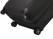 Load image into Gallery viewer, Close up to the wheels on the black suitcase.