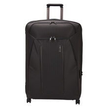 Load image into Gallery viewer, Front panel view of the black suitcase with the telescopic handle partly extended.