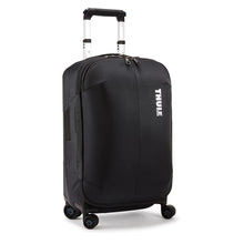 Load image into Gallery viewer, Angled front panel view of the black suitcase with the telescopic handle partly extended.