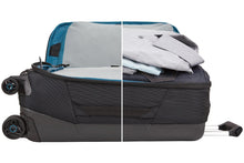 Load image into Gallery viewer, Side panel view of the suitcase showing two views: One with the front panel unzipped, and another with the main compartment unzipped and filled with clothes.