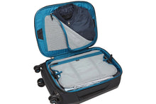 Load image into Gallery viewer, Interior view of the suitcase arranged with clothes, and zipper-closing panels.