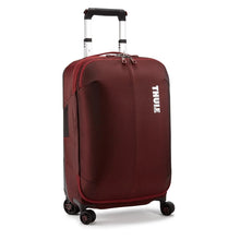 Load image into Gallery viewer, Angled front panel view of the spinner suitcase in Ember Red with the telescopic handle partly extended.