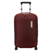 Load image into Gallery viewer, Front panel view of the Ember Red suitcase with the telescopic handle partly extended.