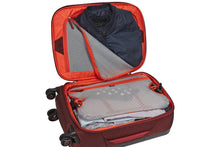 Load image into Gallery viewer, Interior view of the suitcase featuring zipper-closing pockets and a panel to hold the main compartment's contents in place .
