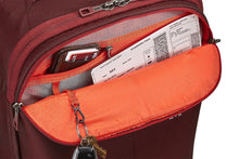Load image into Gallery viewer, Close up to the front panel's pocket shown with a wallet, a key sling, and a boarding pass arranged inside.