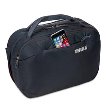 Load image into Gallery viewer, Angled front panel view of the black back with a phone tucked in the pocket.