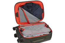 Load image into Gallery viewer, Angled interior view of the suitcase filled with folded clothes.