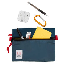 Load image into Gallery viewer, Front panel view of the blue bag with stationery peeking from the unzipped pocket. (accessories not included)