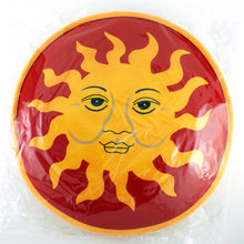 Load image into Gallery viewer, Front view of the tortilla warmer with a yellow sun on a red background.