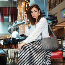 Load image into Gallery viewer, Travelon Parkview Expansion Crossbody, with Model