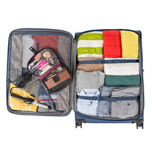 Load image into Gallery viewer, Interior view of the blue suitcase filled with clothes and travel accessories.