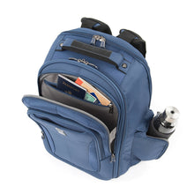Load image into Gallery viewer, Angled top panel view of the blue backpack filled with travel accessories.