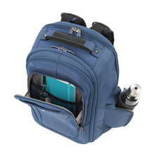 Load image into Gallery viewer, Angled top panel view of of the blue backpack. The front and side pockets are unzipped, and filled with accessories.
