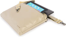 Load image into Gallery viewer, Angled view of the bag with a tablet peeking through the zipper-closing pockets. The adjustable strap is un-clipped.