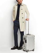 Load image into Gallery viewer, A young man holding the suitcase by the extended telescopic handle.