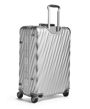 Load image into Gallery viewer, Angled back panel view of the suitcase with the telescopic handle extended.