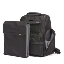 Load image into Gallery viewer, Angled front panel view of the backpack with the removable file divider placed in front.