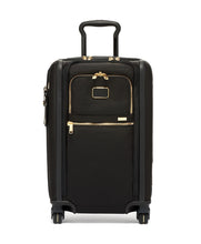 Load image into Gallery viewer, Front panel view of the suitcase with the telescopic handle partly extended.