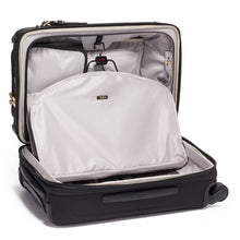 Load image into Gallery viewer, Interior view of the suitcase showing a foldable garment holder.