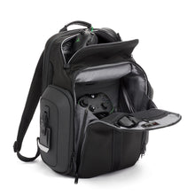Load image into Gallery viewer, Angled front panel view of the backpack with the top and front panels opened. The top panel has a set of headphones fitted inside, and the front panel has a black Xbox controller and a mouse inside a compartment.