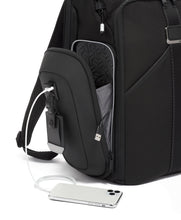 Load image into Gallery viewer, Close up to the opened pocket on the side panel. It features a tag, and above it, a USB plug to charge your mobile devices on the go. A battery bank is required, but not included.