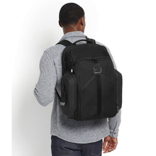 Load image into Gallery viewer, A young man carrying the backpack on his back with the shoulder straps.