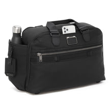 Load image into Gallery viewer, Angled front panel view of the duffel bag. There is a phone pocket between the grab handles, and a water bottle peeking on the side panel. (Water bottle not included).