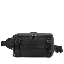 Load image into Gallery viewer, Front panel view of the black sling bag, featuring a set of adjustable straps and a dual-zipper closure.