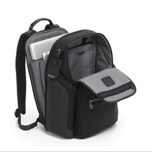 Load image into Gallery viewer, Angled view of the black backpack. The front and back compartments are unzipped and offer an interior view. The back panel a laptop and tablet pockets.