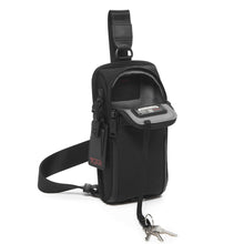 Load image into Gallery viewer, Angled front panel view of the sling bag with the main compartment unzipped. It features a key sling attached to the interior.