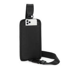 Load image into Gallery viewer, Back panel view of the sling bag, showing a cellphone peeking from the pocket.
