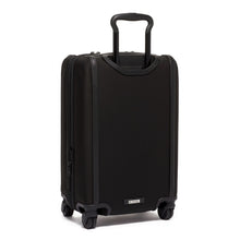 Load image into Gallery viewer, Angled back panel view of the black suitcase with the telescopic handle extended.