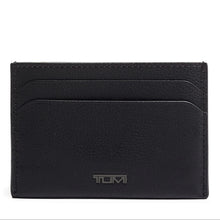 Load image into Gallery viewer, Front panel view of the money card case. A small Tumi logo is visible at the center bottom and two card slots are available.