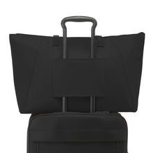 Load image into Gallery viewer, Back panel view showing the attachment strap used on the telescopic handle of a suitcase to keep it in place.