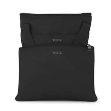 Load image into Gallery viewer, The tote bag partially folded and stored into its included storage bag.