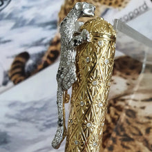 Load image into Gallery viewer, Close up to the diamond-encrusted leopard, which functions as a clip on the pen's cap.