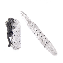 Load image into Gallery viewer, Angled view of the rollerball with the cap set to the side.