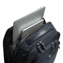 Load image into Gallery viewer, Angled top view of the backpack showing a laptop and tablet peeking from the back compartment.