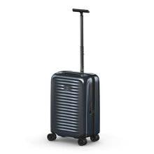 Load image into Gallery viewer, Angled front view of the navy blue suitcase with the telescopic handle extended.