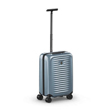 Load image into Gallery viewer, Angled front view of the light blue suitcase with the telescopic handle extended.